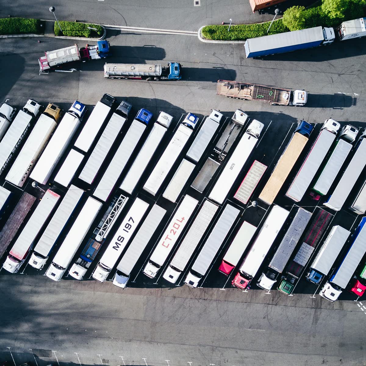 Aerial view of trucks queued at a freight yard